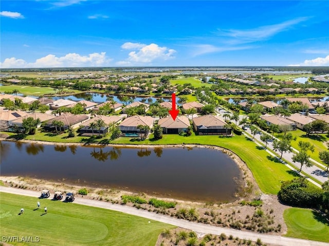 bird's eye view with golf course view, a residential view, and a water view