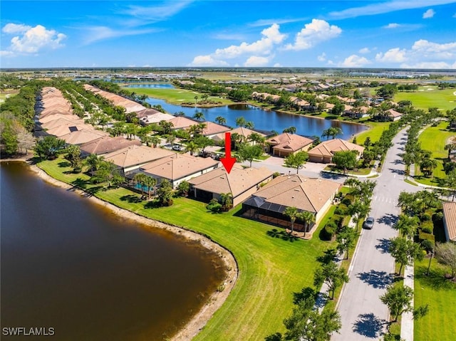 bird's eye view featuring a water view and a residential view