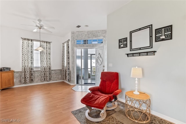 3895 Sabal Springs Blvd, North Fort Myers, FL 33917 - sitting room featuring baseboards, a ceiling fan, and wood finished floors