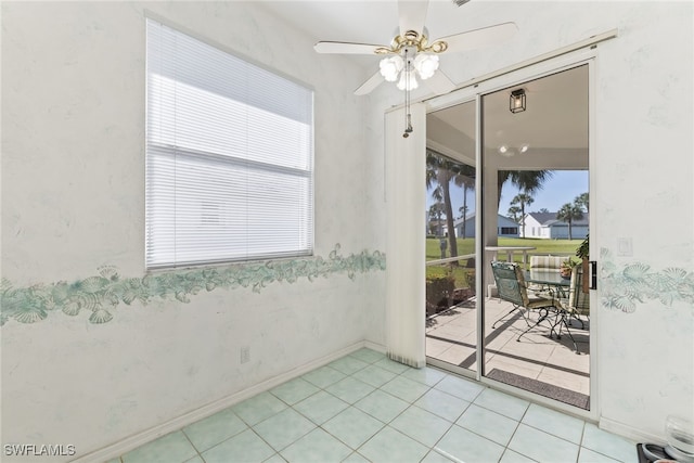 3895 Sabal Springs Blvd, North Fort Myers, FL 33917 - spare room with ceiling fan, baseboards, and light tile patterned floors