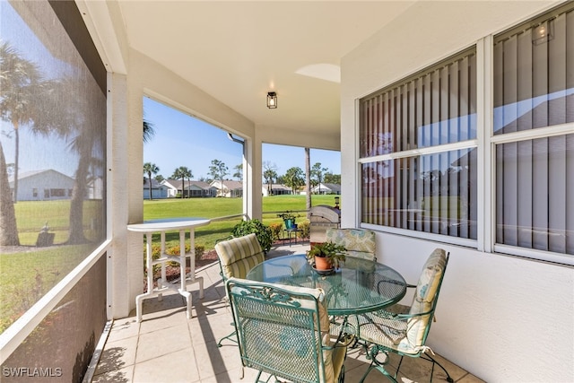 3895 Sabal Springs Blvd, North Fort Myers, FL 33917 - sunroom / solarium featuring a residential view and outdoor dining area