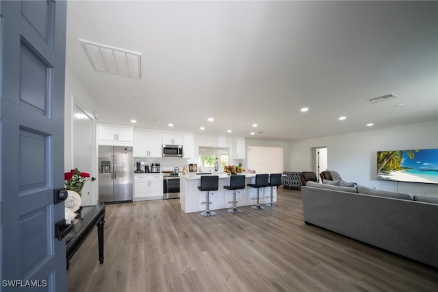 2333 Westwood Rd, North Fort Myers, FL 33917 - living area with recessed lighting and light wood-style flooring