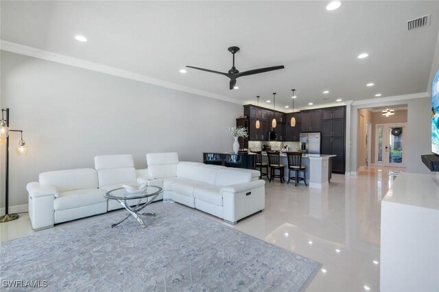 4318 Aurora St, Naples, FL 34119 - living area featuring a ceiling fan, ornamental molding, recessed lighting, and light tile patterned floors
