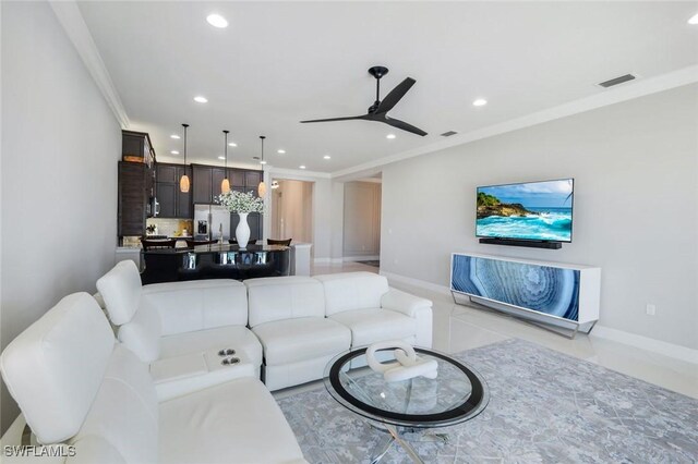4318 Aurora St, Naples, FL 34119 - living room featuring recessed lighting, a ceiling fan, crown molding, baseboards, and light tile patterned floors