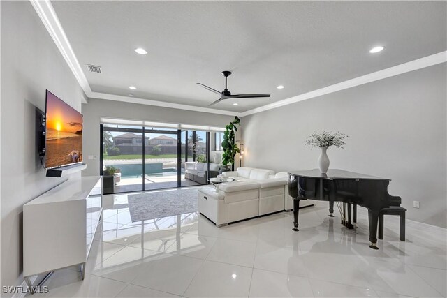 4318 Aurora St, Naples, FL 34119 - living room featuring crown molding, a ceiling fan, recessed lighting, and light tile patterned floors