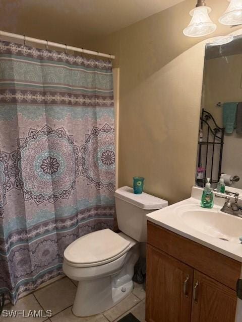 bathroom with toilet, tile patterned floors, vanity, and a shower with curtain