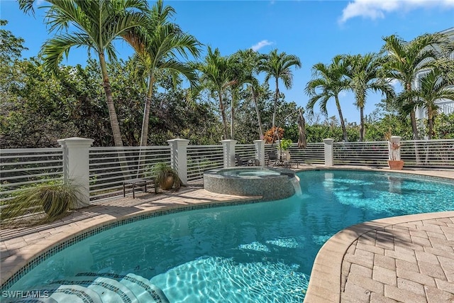 view of pool featuring a pool with connected hot tub