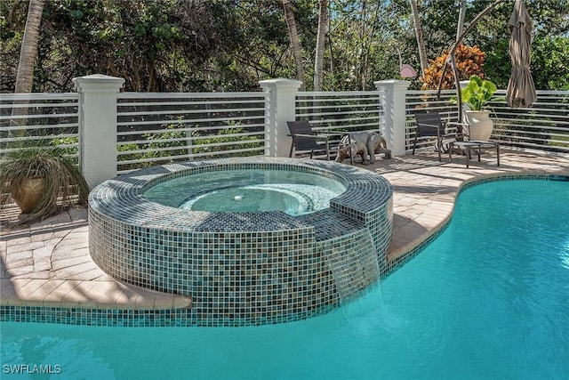 view of pool featuring an in ground hot tub and a fenced in pool