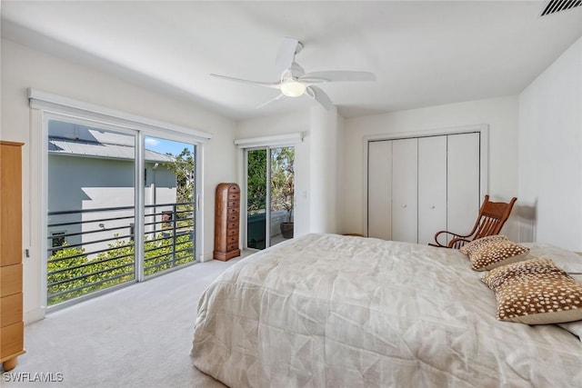 bedroom featuring carpet, access to outside, ceiling fan, visible vents, and a closet