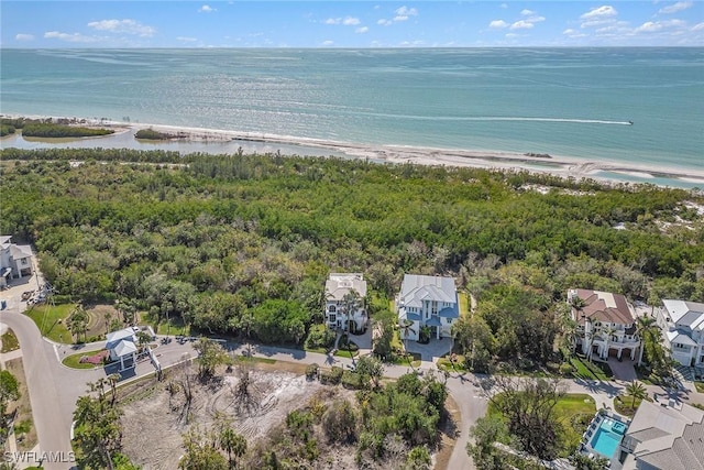 bird's eye view featuring a water view and a view of the beach