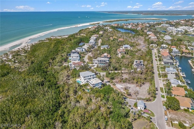 drone / aerial view with a water view and a residential view