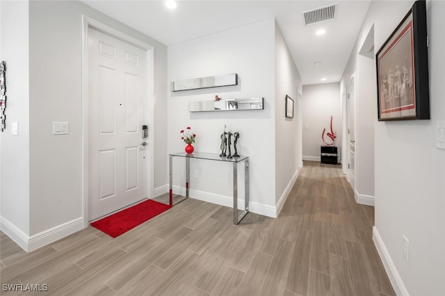 6953 Avalon Cir Unit 1804, Naples, FL 34112 - foyer with light wood-type flooring, baseboards, and recessed lighting