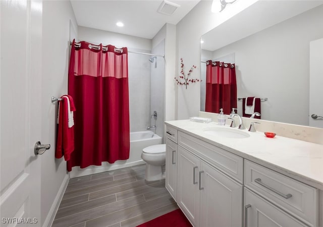 6953 Avalon Cir Unit 1804, Naples, FL 34112 - bathroom with vanity, toilet, wood finished floors, shower / bathtub combination with curtain, and recessed lighting