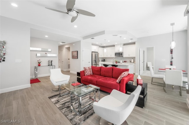 6953 Avalon Cir Unit 1804, Naples, FL 34112 - living room with ceiling fan, light wood-type flooring, baseboards, and recessed lighting