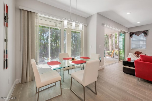 6953 Avalon Cir Unit 1804, Naples, FL 34112 - dining room with baseboards, wood finished floors, and recessed lighting