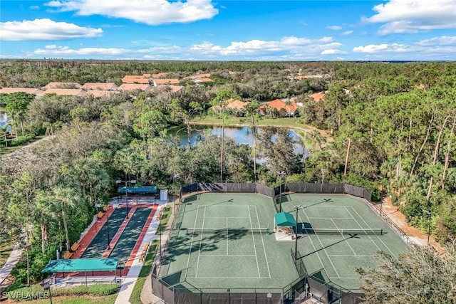 aerial view featuring a water view and a view of trees