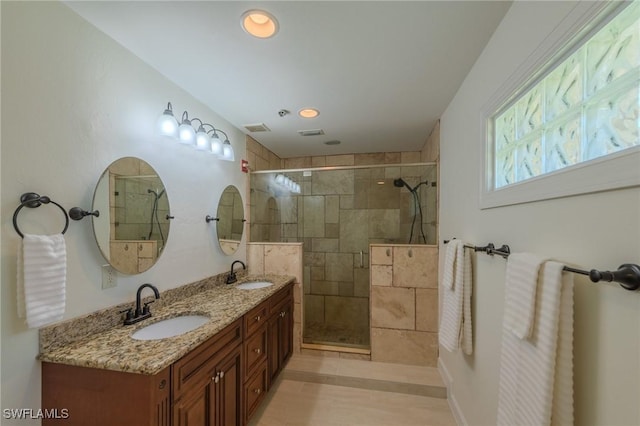 20587 Charing Cross Cir, Estero, FL 33928 - full bathroom featuring a tile shower, double vanity, and recessed lighting