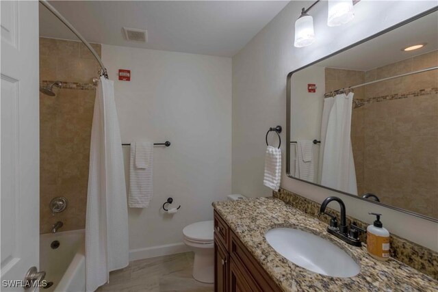 20587 Charing Cross Cir, Estero, FL 33928 - bathroom featuring vanity, toilet, shower / bathtub combination with curtain, and baseboards