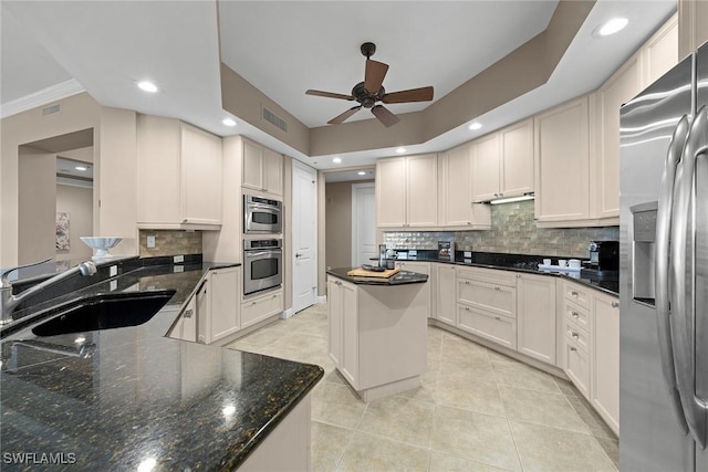 24031 Via Castella Dr Unit 1302, Bonita Springs, FL 34134 - kitchen with visible vents, light tile patterned flooring, stainless steel appliances, a ceiling fan, and a sink