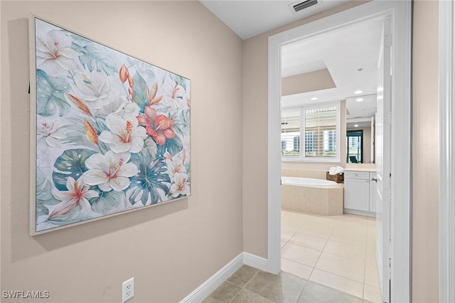 24031 Via Castella Dr Unit 1302, Bonita Springs, FL 34134 - hallway featuring light tile patterned floors, visible vents, recessed lighting, and baseboards