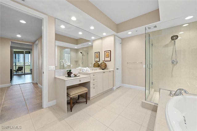 24031 Via Castella Dr Unit 1302, Bonita Springs, FL 34134 - full bath featuring tile patterned floors, a garden tub, a stall shower, baseboards, and vanity