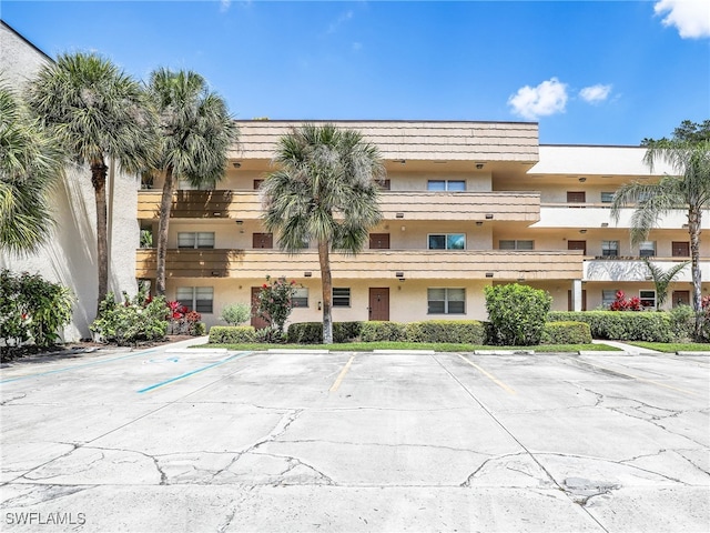 499 Forest Lakes Blvd Unit 308, Naples, FL 34105 - view of building exterior with uncovered parking
