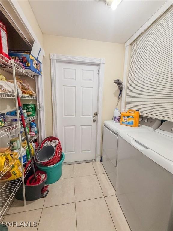 3911 9th St SW, Lehigh Acres, FL 33976 - laundry room with laundry area, independent washer and dryer, and light tile patterned flooring