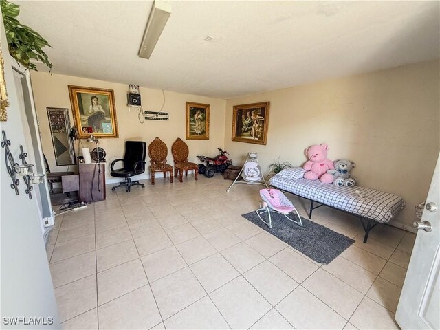 3911 9th St SW, Lehigh Acres, FL 33976 - sitting room with light tile patterned floors