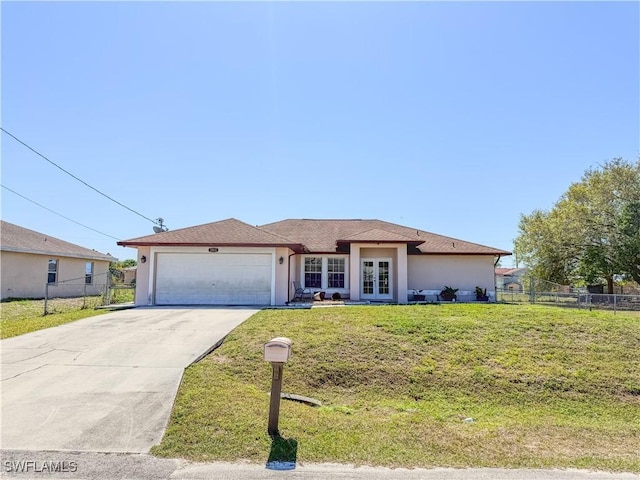 3911 9th St SW, Lehigh Acres, FL 33976 - ranch-style house featuring fence, stucco siding, french doors, concrete driveway, and an attached garage