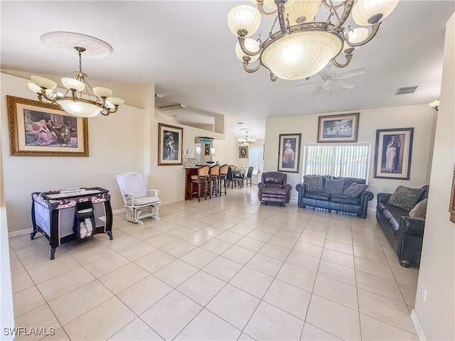 3911 9th St SW, Lehigh Acres, FL 33976 - living area with baseboards, visible vents, light tile patterned floors, and ceiling fan with notable chandelier