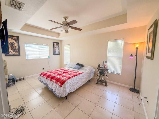 3911 9th St SW, Lehigh Acres, FL 33976 - bedroom with baseboards, visible vents, light tile patterned floors, and a raised ceiling