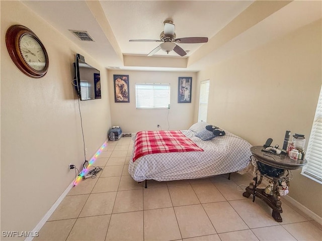 3911 9th St SW, Lehigh Acres, FL 33976 - tiled bedroom featuring visible vents, a raised ceiling, baseboards, and a ceiling fan