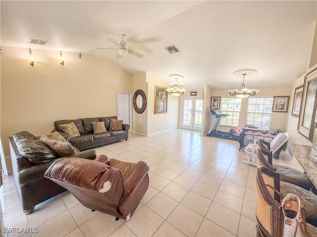 3911 9th St SW, Lehigh Acres, FL 33976 - living area featuring light tile patterned floors, ceiling fan with notable chandelier, french doors, and visible vents