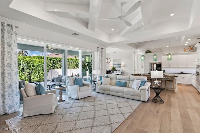 living area with recessed lighting, a ceiling fan, visible vents, and light wood-type flooring