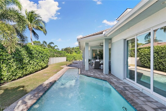 view of swimming pool featuring a fenced in pool, a fenced backyard, an outdoor hangout area, ceiling fan, and a patio area