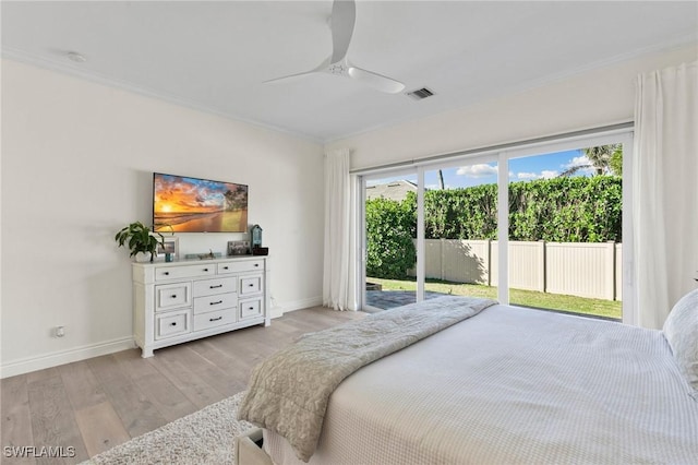 bedroom with light wood-style flooring, baseboards, ornamental molding, access to exterior, and visible vents