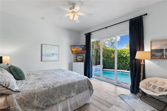 bedroom featuring a ceiling fan, wood finished floors, and access to exterior