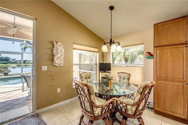 2626 Astwood Ct, Cape Coral, FL 33991 - dining room with lofted ceiling, a water view, ceiling fan, and light tile patterned floors