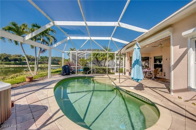 2626 Astwood Ct, Cape Coral, FL 33991 - outdoor pool with glass enclosure, ceiling fan, and a patio