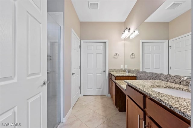 6068 Triumph Ln, Ave Maria, FL 34142 - full bath with vanity, a shower stall, visible vents, and tile patterned flooring