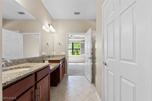 6068 Triumph Ln, Ave Maria, FL 34142 - bathroom featuring visible vents, vanity, a ceiling fan, and tile patterned flooring