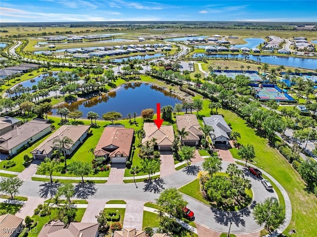 6068 Triumph Ln, Ave Maria, FL 34142 - aerial view with a water view and a residential view