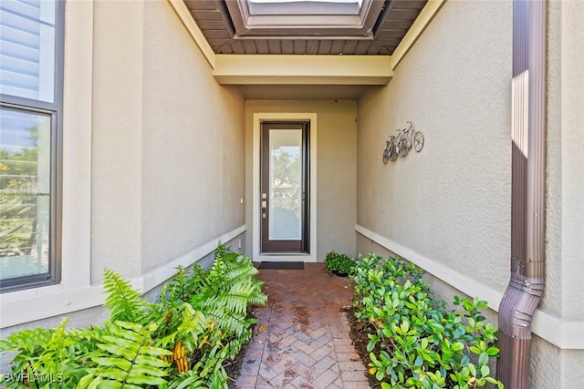 6068 Triumph Ln, Ave Maria, FL 34142 - view of exterior entry featuring stucco siding