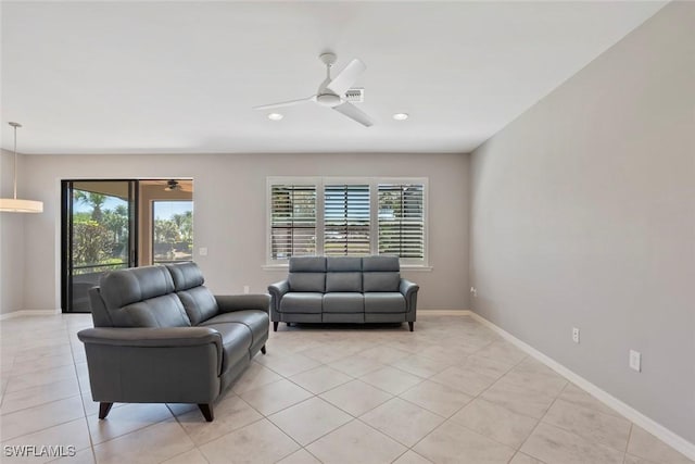 6068 Triumph Ln, Ave Maria, FL 34142 - living room with light tile patterned floors, recessed lighting, baseboards, and ceiling fan