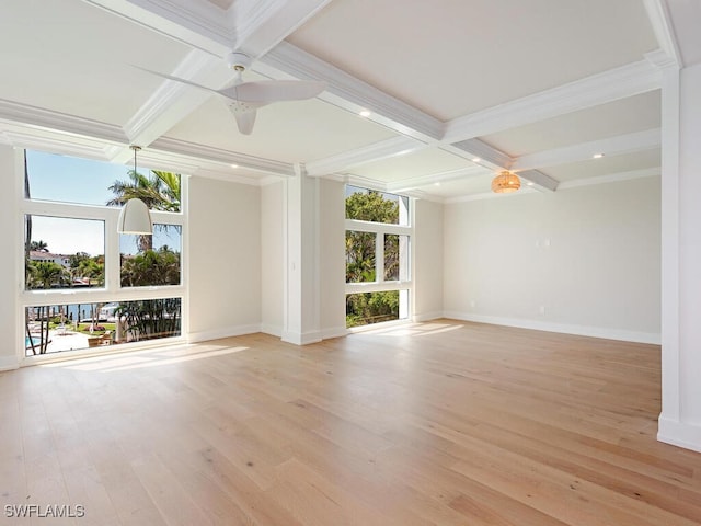 unfurnished room with beamed ceiling, ornamental molding, coffered ceiling, light wood-style floors, and baseboards