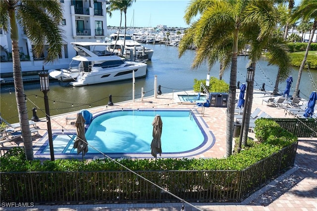 1490 5th Ave S Unit 200B, Naples, FL 34102 - dock with a water view and a community pool