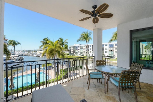 1490 5th Ave S Unit 200B, Naples, FL 34102 - balcony featuring a ceiling fan and a water view
