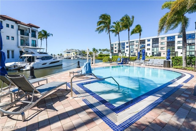 1490 5th Ave S Unit 200B, Naples, FL 34102 - community pool featuring central AC unit and a water view