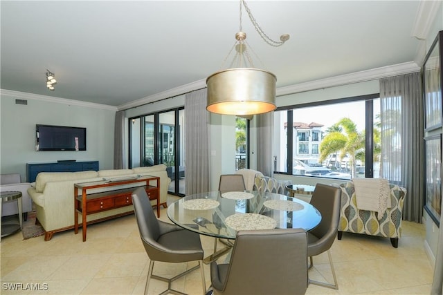 1490 5th Ave S Unit 200B, Naples, FL 34102 - dining room with crown molding, light tile patterned floors, and healthy amount of natural light