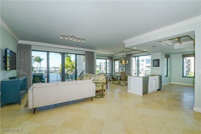 1490 5th Ave S Unit 200B, Naples, FL 34102 - living area with crown molding, light tile patterned flooring, and baseboards